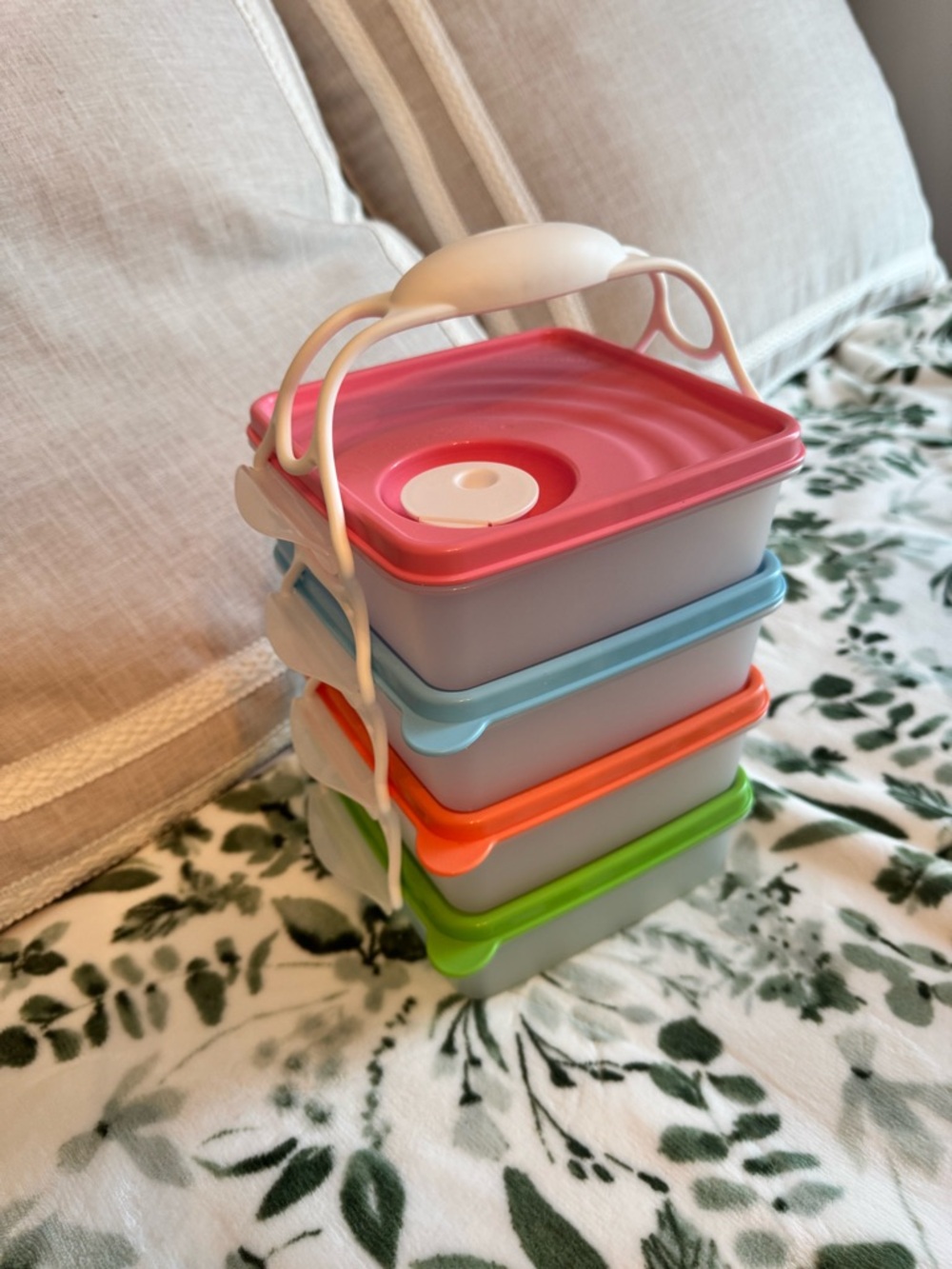 Tupperware Stacked food storage containers with carrier handle